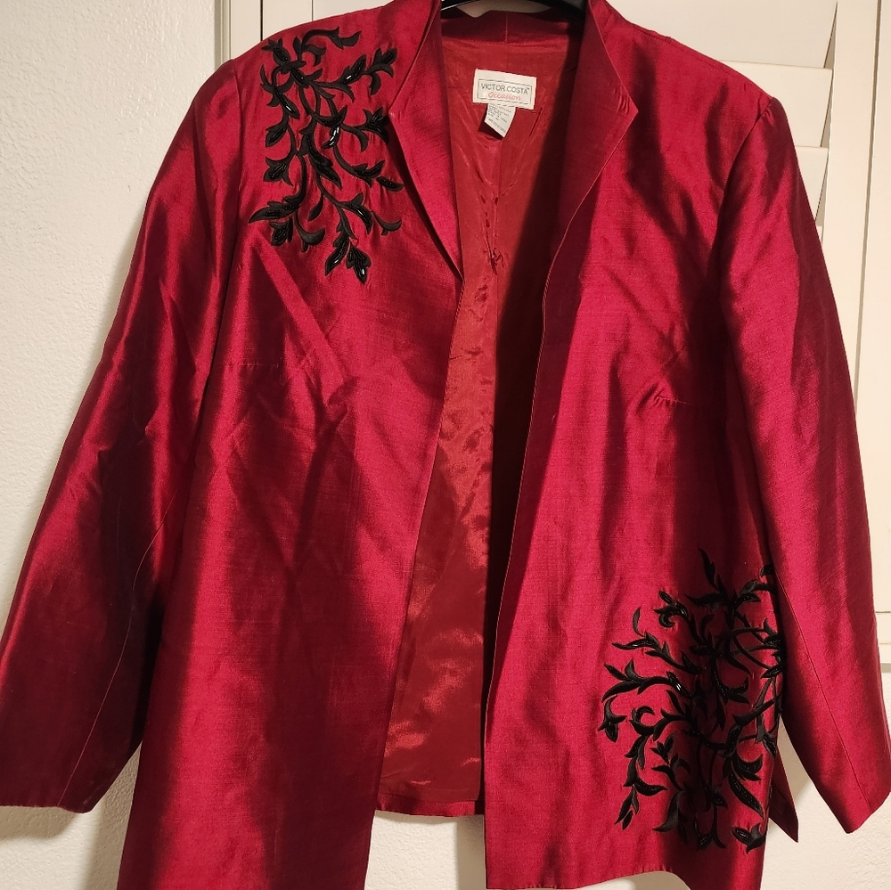 Red cardigan jacket with black embroidered detail